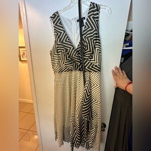 Brown and cream dress with belt.